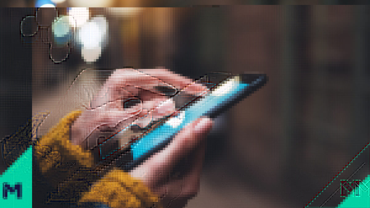 Close-up of woman's hands holding a smartphone